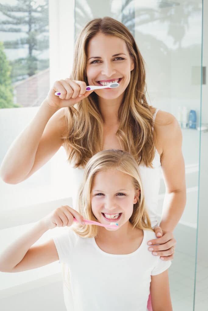 mother.daughter.brushing.teeth Vaccaeo Aesthetic